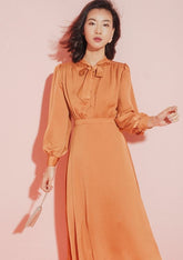Silk Midi Dress with Tie-Neck Detail and Long Sleeves